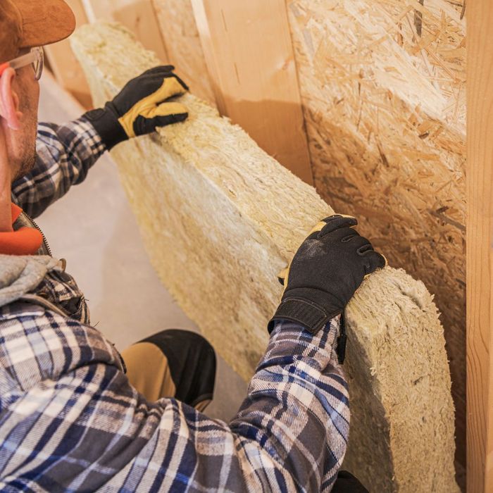 contractor repairing wall